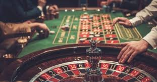 Live dealer at blackjack table, multiple camera angles showing cards and chips